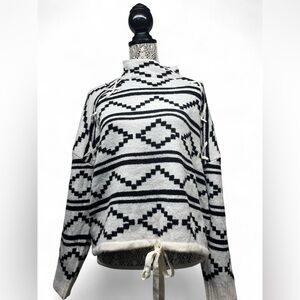 Chic Black and White Geometric Turtleneck Sweater